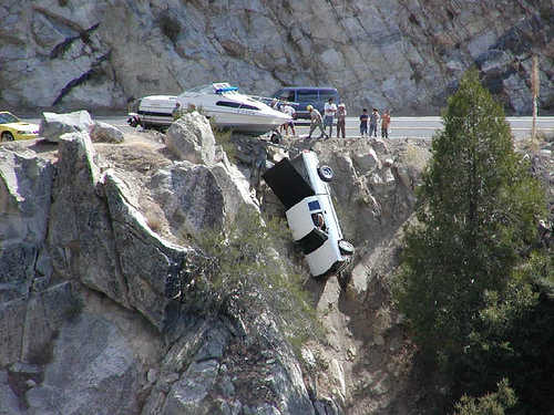 Boat tips car over the edge