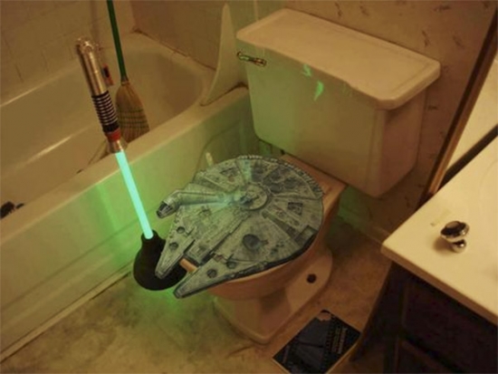 Millenium Falcon toilet seat and lightsaber toilet plunger