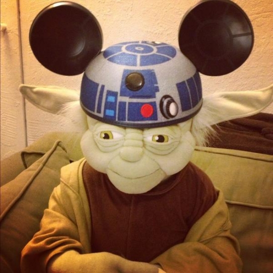 Yoda wearing an R2D2 hat